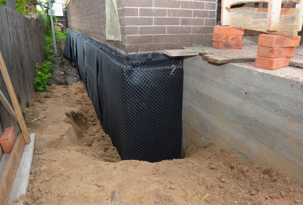 Happy homeowners after waterproofing job in Clayton